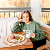 Unisex green MATCHA crewneck sweatshirt with Matcha Nude sleeve logo – printed by Moonlight Makers in Asheville, NC