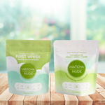 Matcha Nude Premium and First Whisk matcha pouches displayed on wooden table with soft natural background