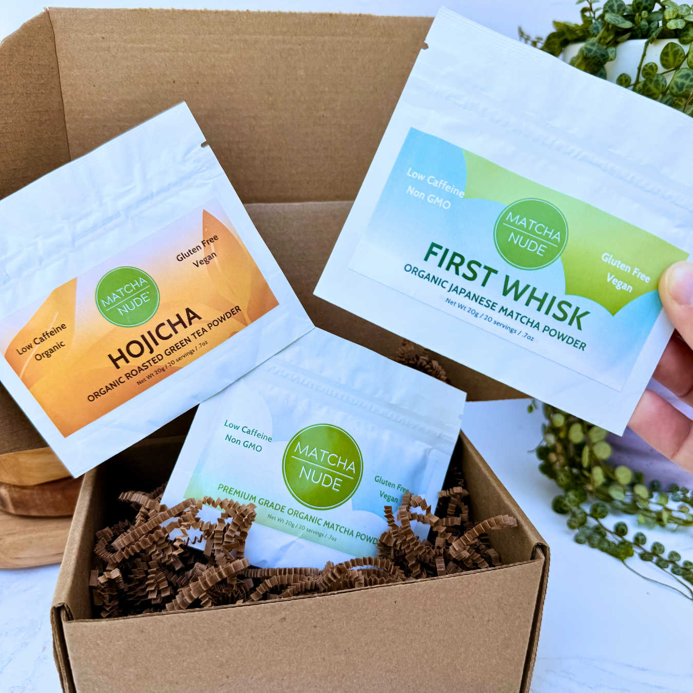 Matcha Nude First Whisk and Hojicha sampler bags inside kraft gift box with Premium Matcha