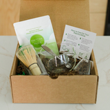 Open Premium Matcha Experience Kit gift box with whisk, bowl, spoon and organic matcha