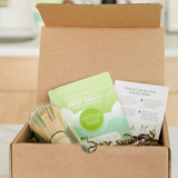Matcha Nude starter pack with matcha powder, bamboo whisk, and spoon in open box
