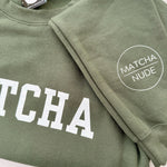 Unisex green MATCHA crewneck sweatshirt with Matcha Nude sleeve logo – printed by Moonlight Makers in Asheville, NC