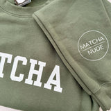 Unisex green MATCHA crewneck sweatshirt with Matcha Nude sleeve logo – printed by Moonlight Makers in Asheville, NC