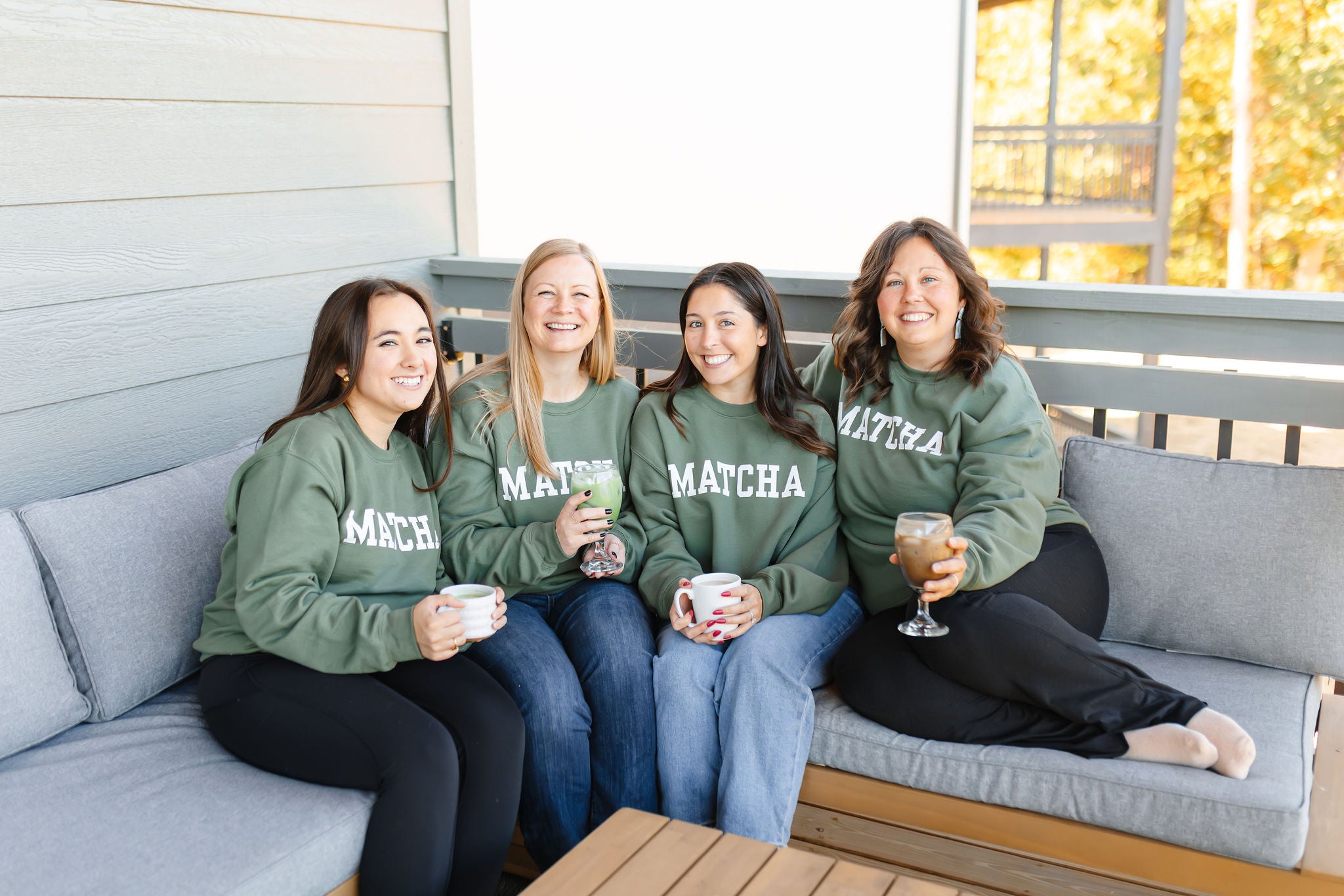 Unisex green MATCHA crewneck sweatshirt with Matcha Nude sleeve logo – printed by Moonlight Makers in Asheville, NC