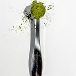 A perfect cup of matcha spoon filled with matcha powder