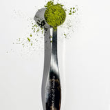 A perfect cup of matcha spoon filled with matcha powder