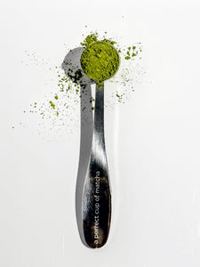 A perfect cup of matcha spoon filled with matcha powder